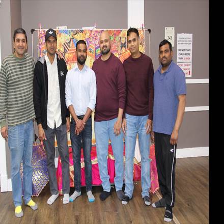 A group of men posing for a photo
AI-generated content may be incorrect.