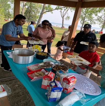 A group of people at a picnic
AI-generated content may be incorrect.